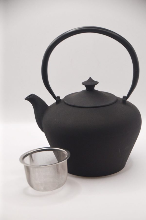 castiron teapot with basket
